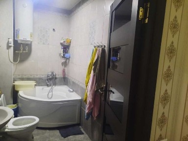 Ko'p qavatli uydagi xonadon