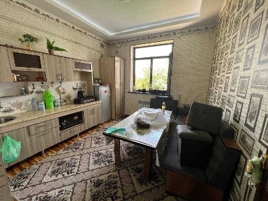 Ko'p qavatli uydagi xonadon